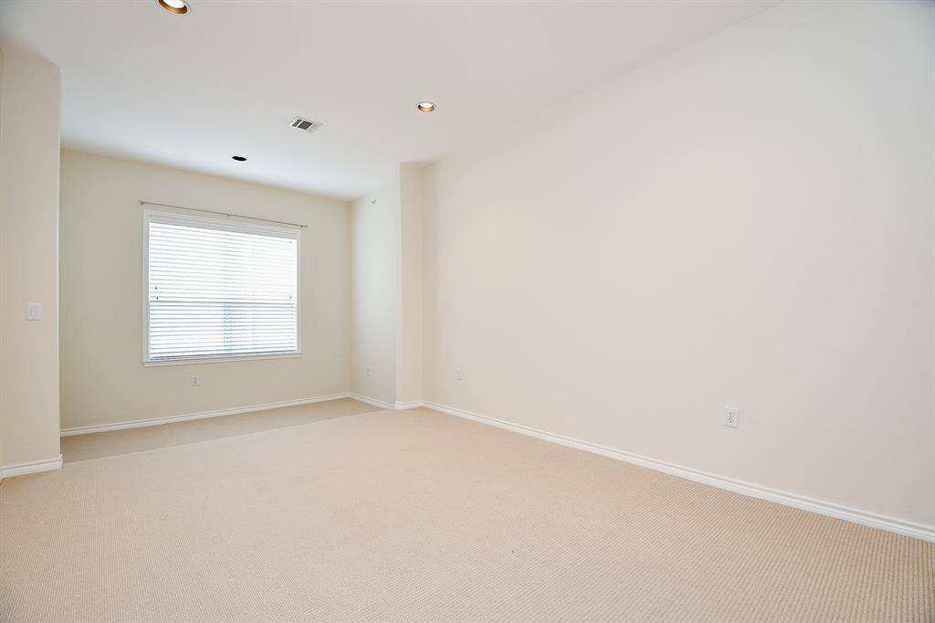 Primary bedroom has attached step down sitting area