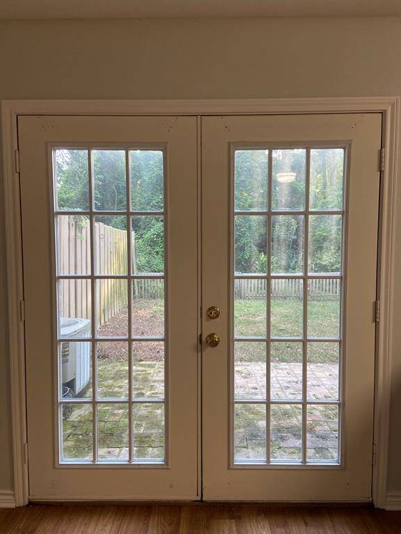Open the doors to a brick patio and generous backyard.