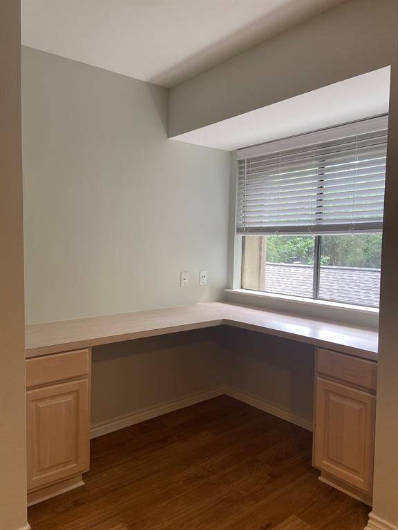 Closeup of the primary bedroom's built-in desk area.