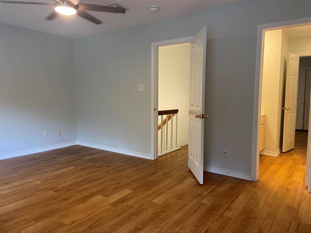 View of the primary room from the built-in desk.  The door on the left leads to the hall; the one on the right leads to the bathroom.