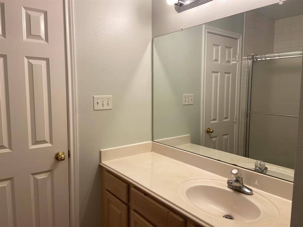 The main bathroom is shared jack-and-jill style between the two bedrooms.