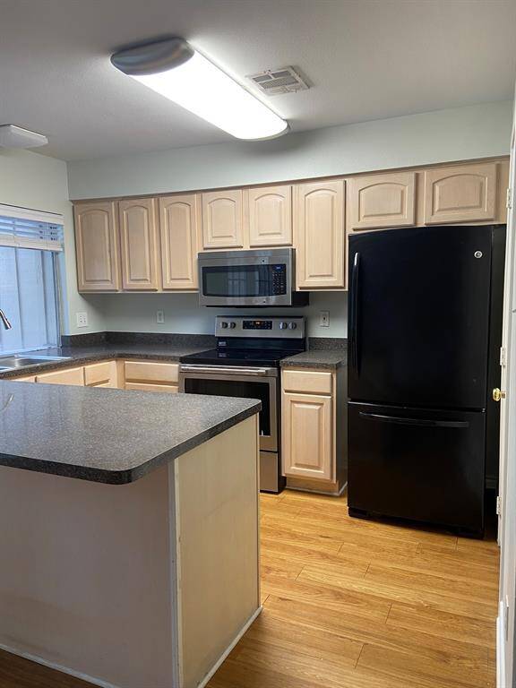 The large breakfast bar makes the kitchen multi-functional.  There is plenty of room to  meal prep and eat!