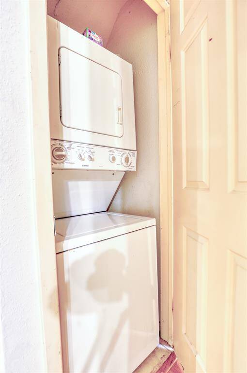 In-unit laundry is tucked away next to the kitchen.