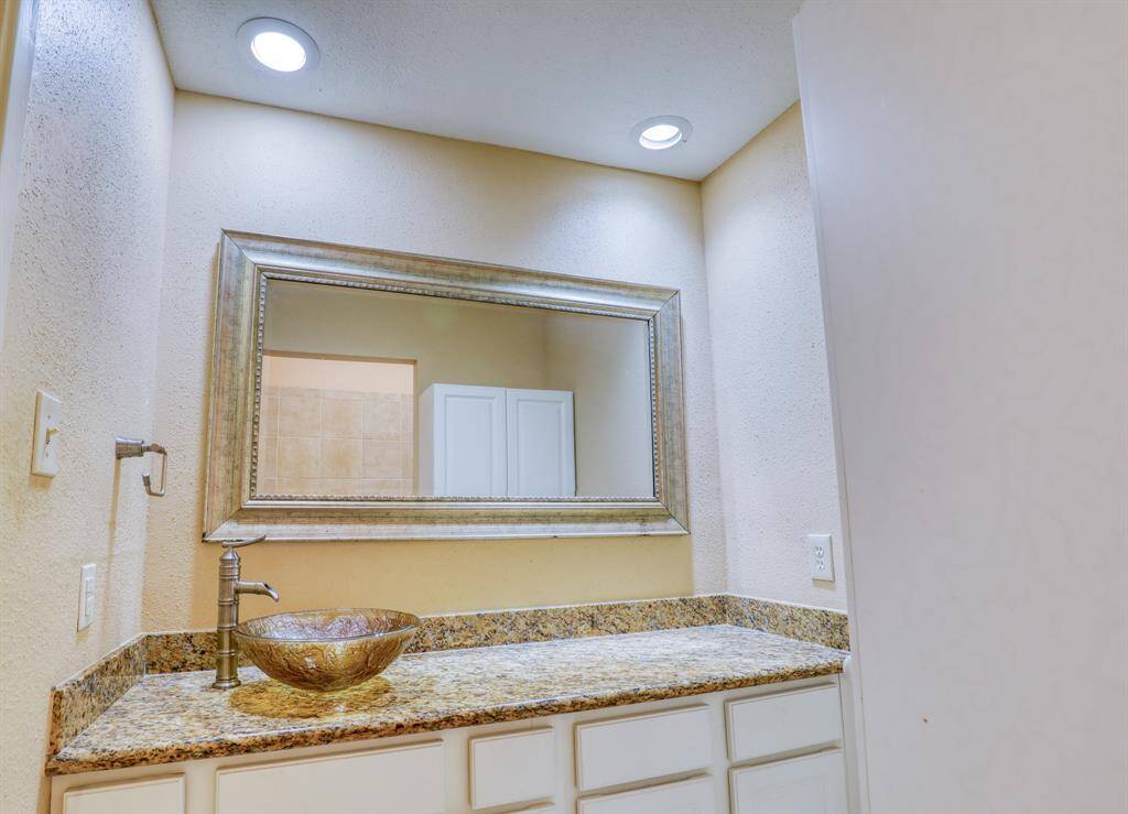 First floor bath includes plenty of counter and storage space.