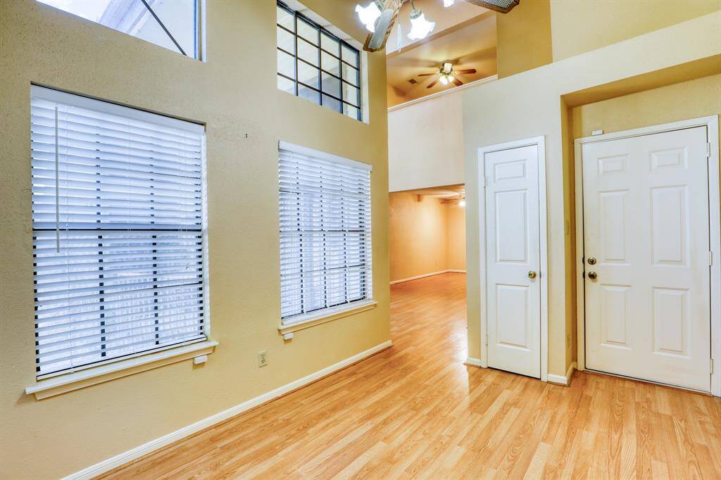 Off the living room is a separate room perfect for a home office. The door on the right leads downstairs to your attached garage.