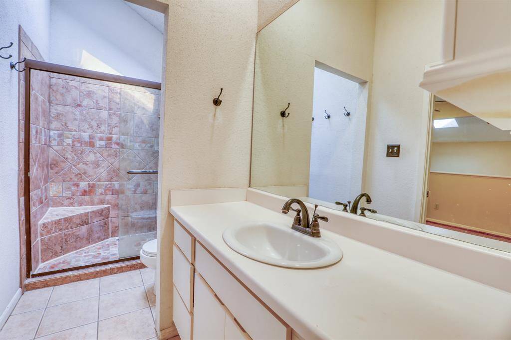 The primary bath features a large walk-in shower.