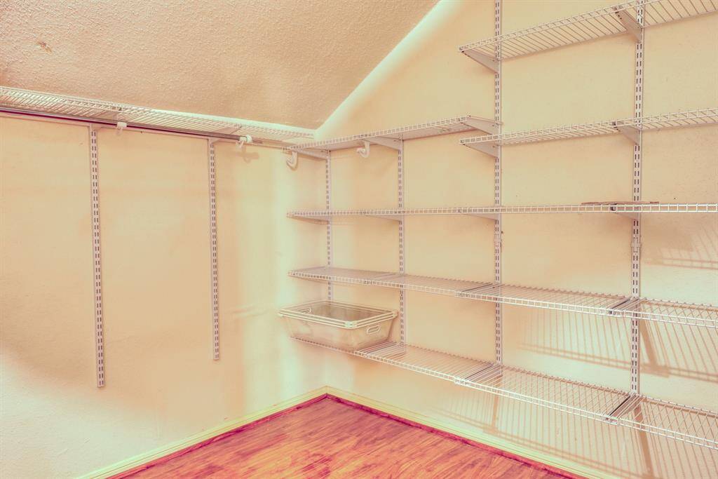 More built-in storage in the primary closet.