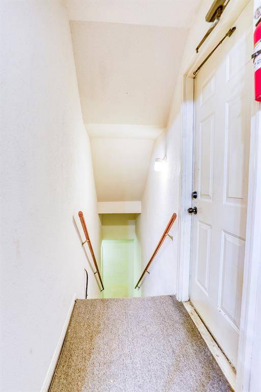 These stairs lead down to your attached 1-car garage.