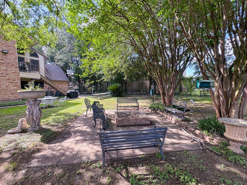Community green space with fire pit and grilling area.