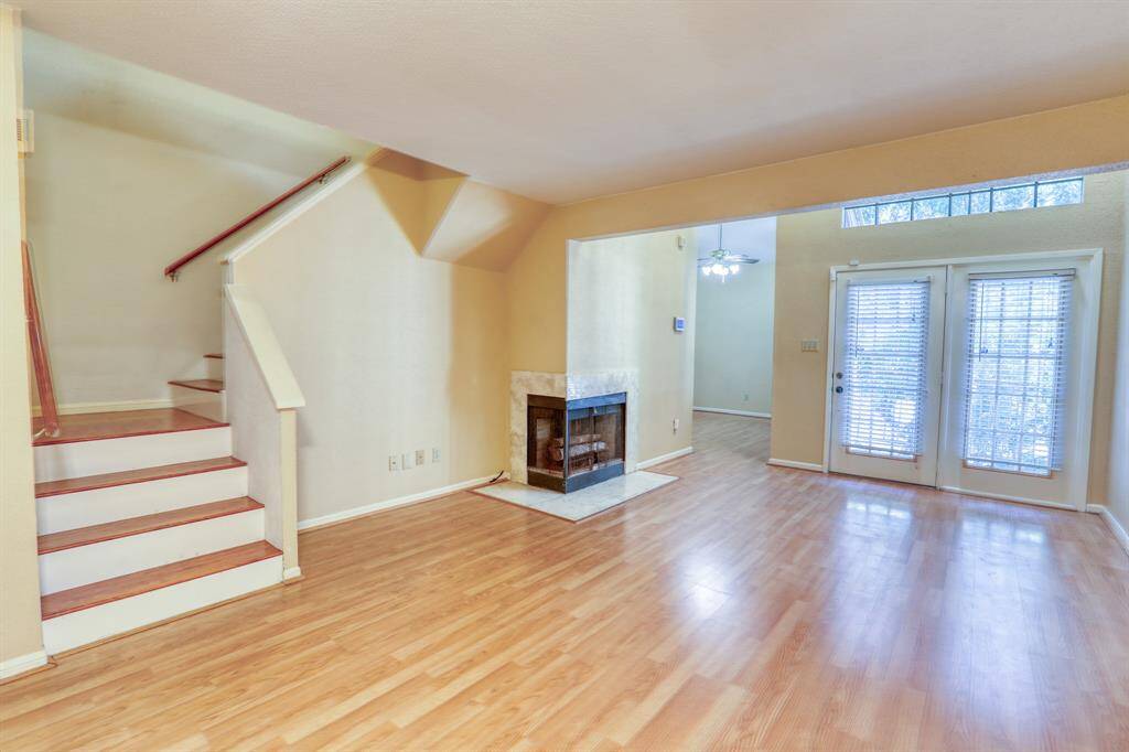From the front door on the right, you enter in to the living/dining area. A wood-burning fireplace is a great focal point in this room.