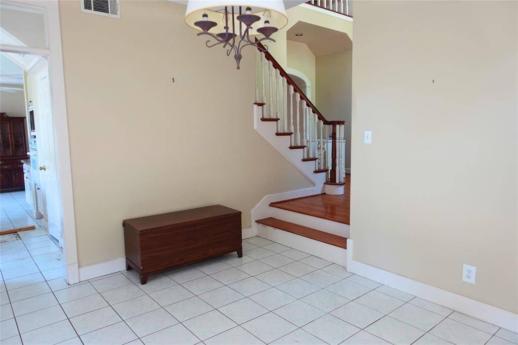 Entryway with Elegant Staircase