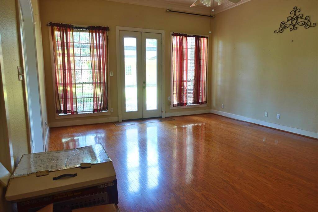Living Room with French Doors and Hardwood Flooring