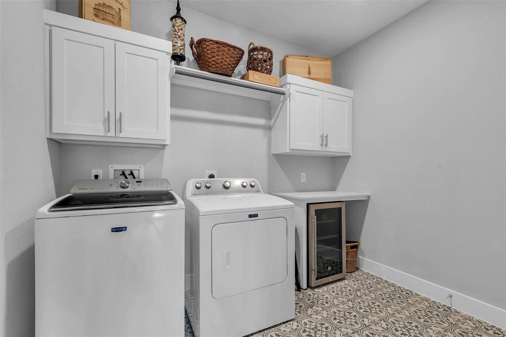 Past the walk-in pantry is the oversized laundry with built-in folding table.