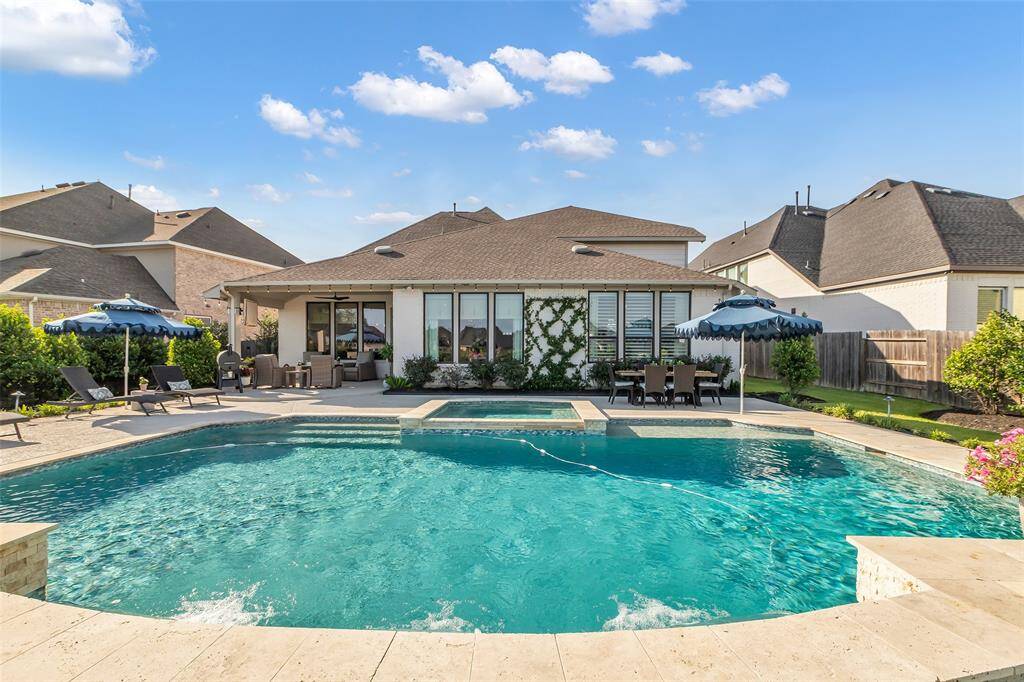 Enjoy the over-sized, sparkling pool with an 8-person hot tub.