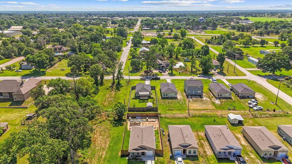Aerial view of the back of the home and community