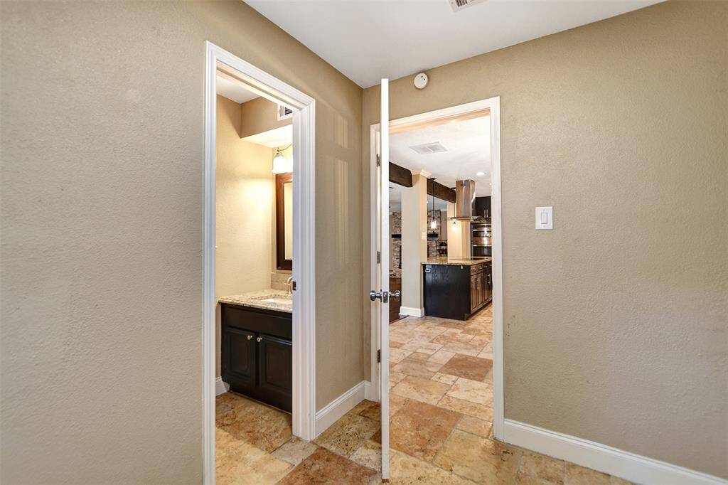 Convenient half bath located off of utility room and easy access from backyard.