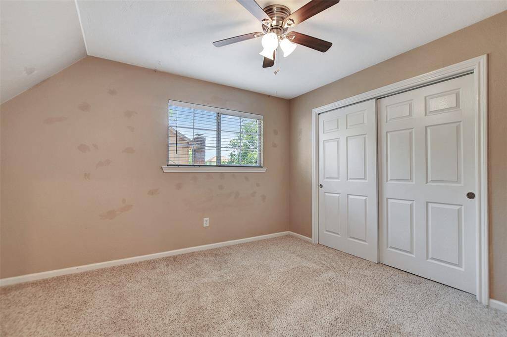 Spacious bedroom with ample closet space.