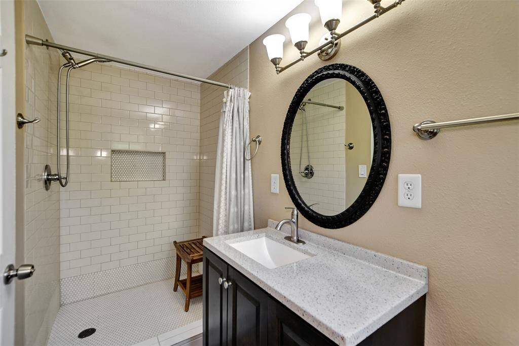 Walk in shower with modern finishes.