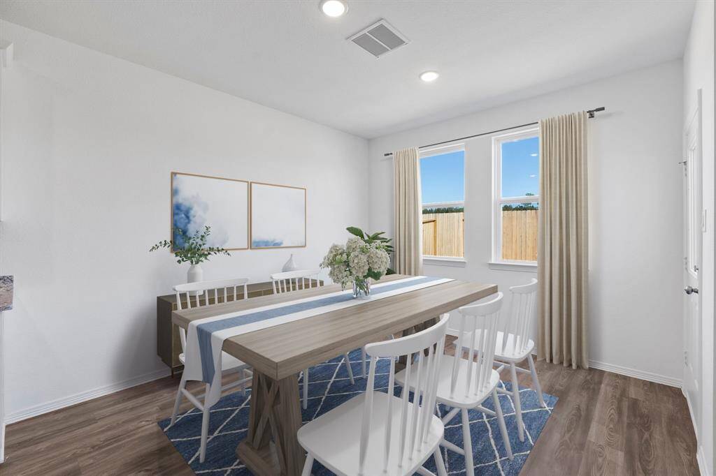 Virtually Staged Breakfast/dining nook located right by the kitchen. Blinds to be installed.