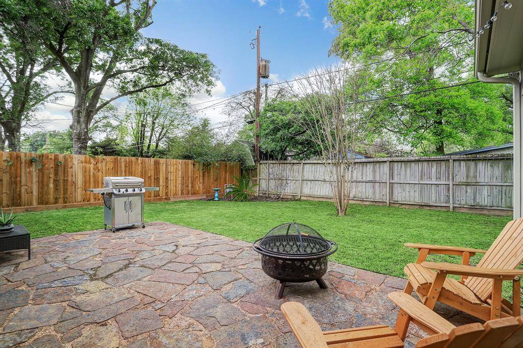 A wonderful backyard with a flagstone patio.