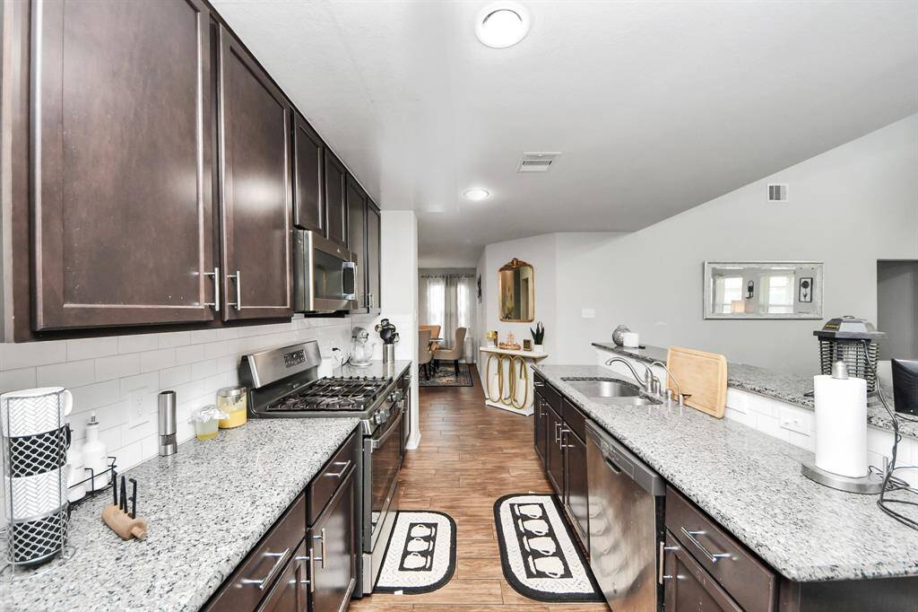 Flow-through view from kitchen into dining area, ideal for entertaining