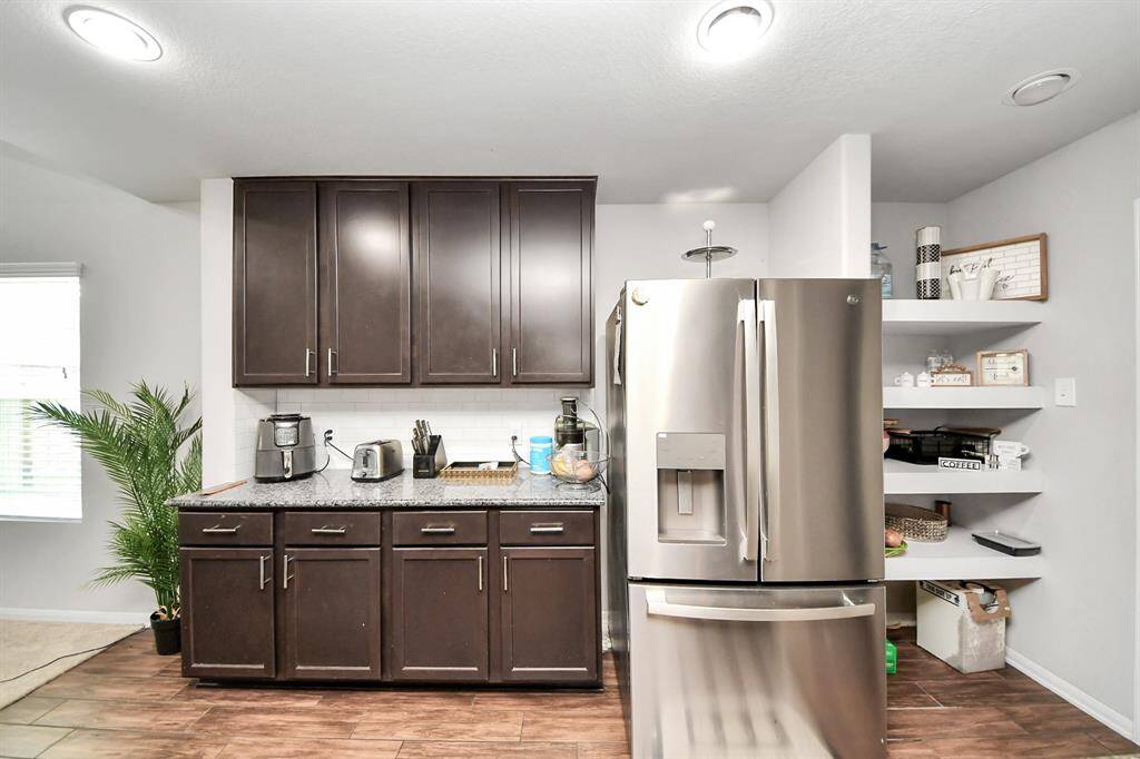 Island-centered kitchen layout with wide walkways and easy access