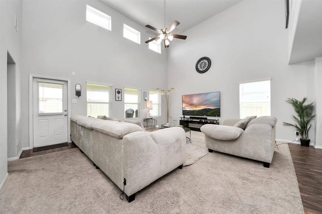 Elegant neutral-toned furniture with a cozy layout ideal for entertaining or relaxing