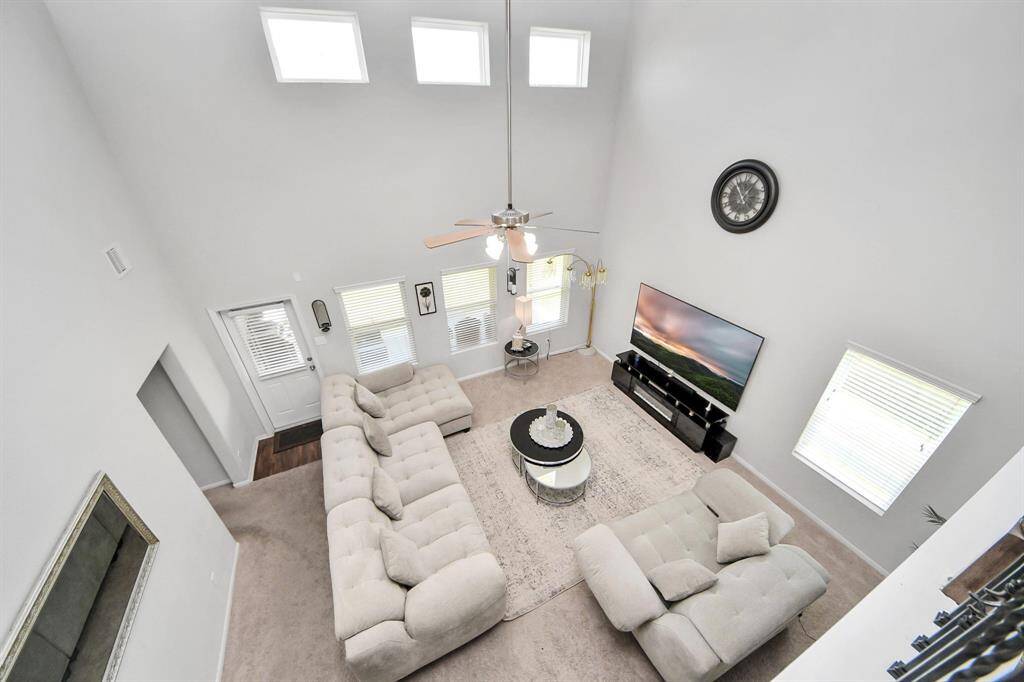 Expansive upstairs game room or second living space, ideal for entertainment or lounge area.