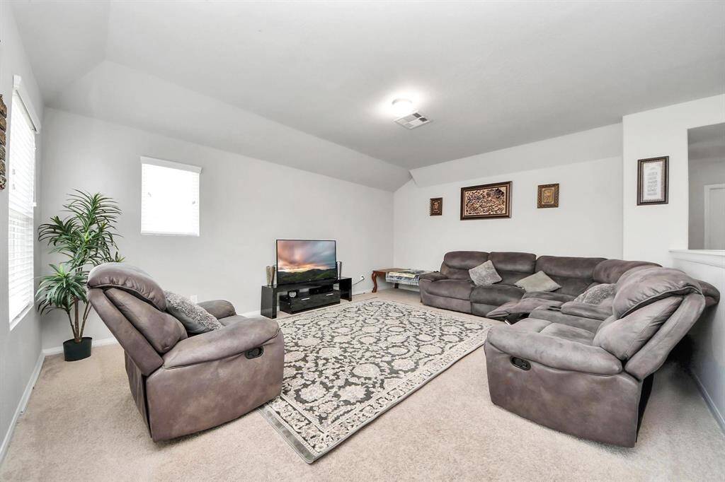 Upstairs landing leading into versatile second living or game room.