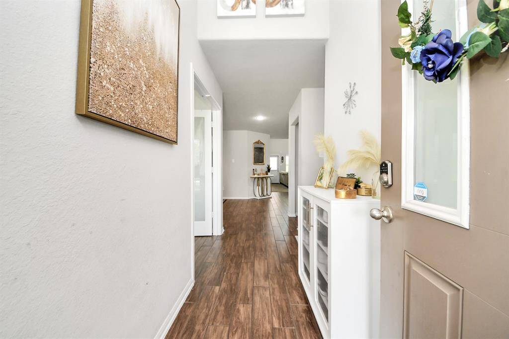 Welcoming entry hallway with modern finishes.