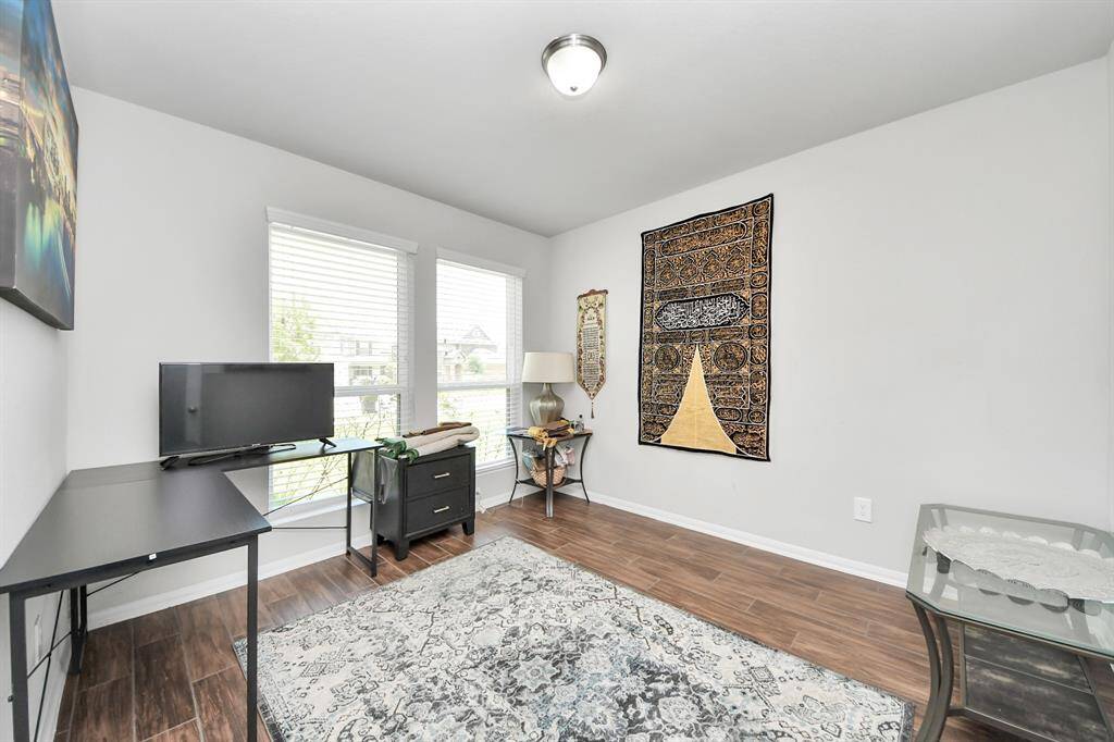 Open foyer view with direct access to flexible bonus room or office.