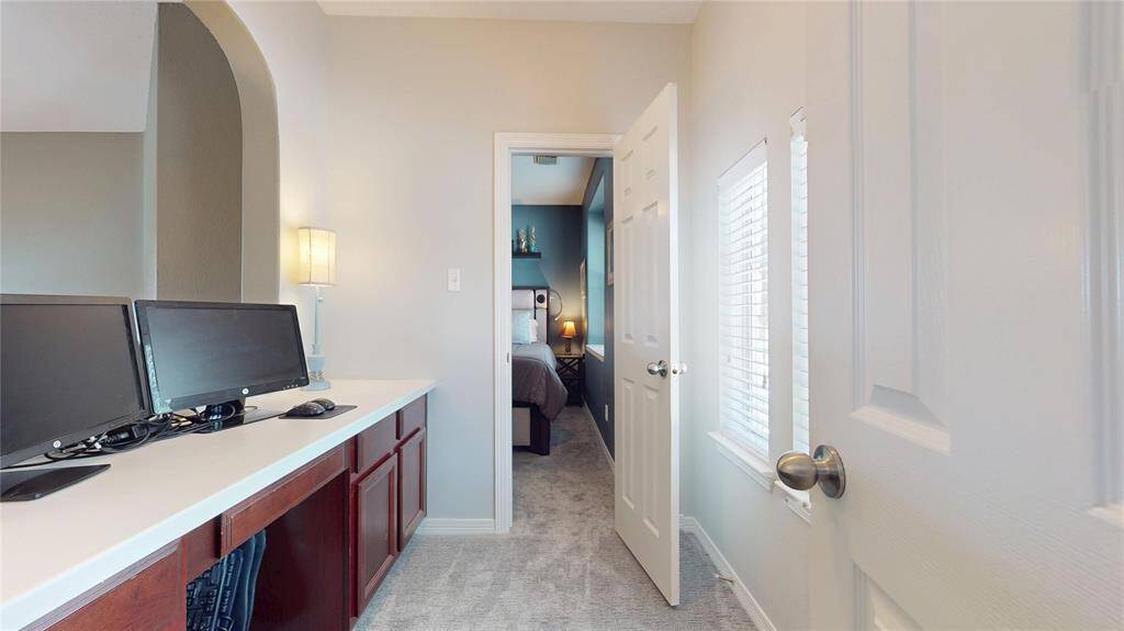 This home includes a convenient built-in study nook located between two of the secondary bedrooms upstairs. Featuring spacious countertops, ample cabinetry for storage, and electrical outlets for technology setup, it’s an ideal spot for homework, remote work, or creative projects
