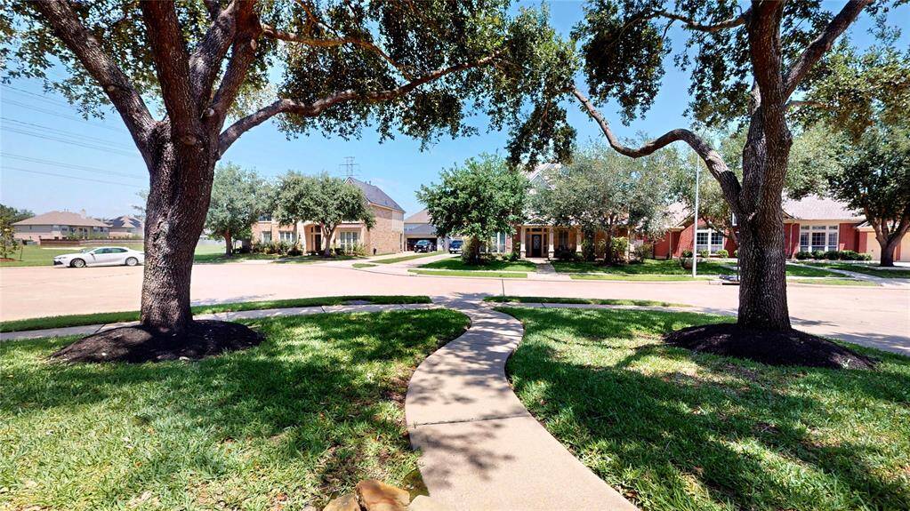 This serene, oversized lot is ideally situated on a quiet cul-de-sac, offering enhanced privacy and minimal through traffic. Mature shade trees provide natural beauty while a winding front walkway adds charm and curb appeal. Enjoy the peaceful setting with no back neighbors