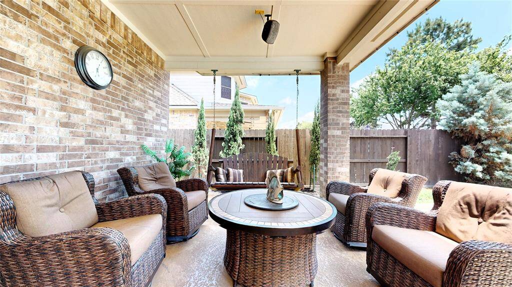 Enjoy outdoor dining under the umbrella or unwind in the shade of the covered patio with comfortable seating