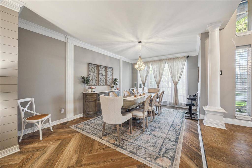 Elegant space with ample room for gatherings, and idea flow from kitchen to living areas.
