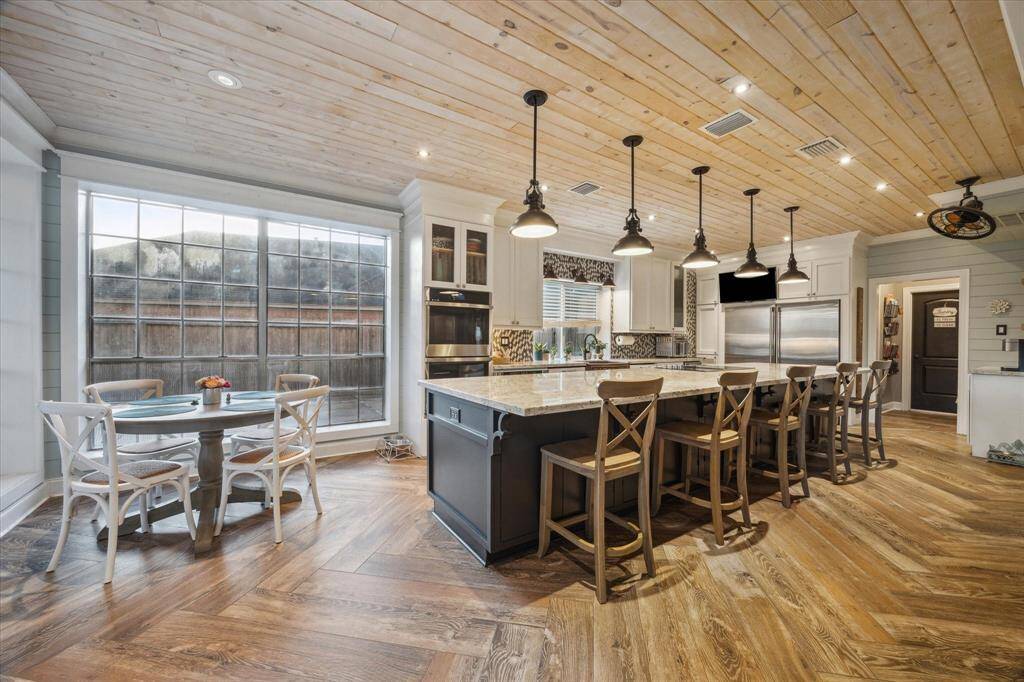 This stylish kitchen features sleek countertops, ample cabinet space, with brand new double ovens. Designed for both everyday cooking and entertaining!