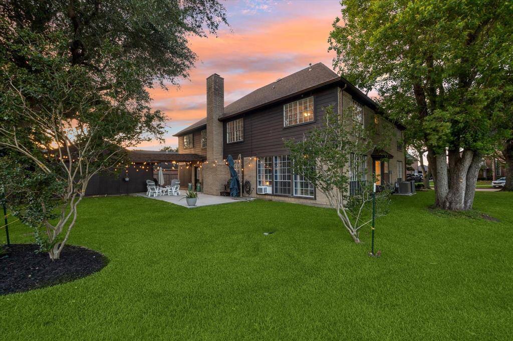 Enjoy a large backyard with plenty of room for entertaining, gardening, or watch the golfers play—perfect for outdoor living and future possibilities.