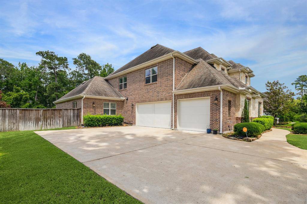 Garage includes generator outlet, epoxied floor, & air conditioning.