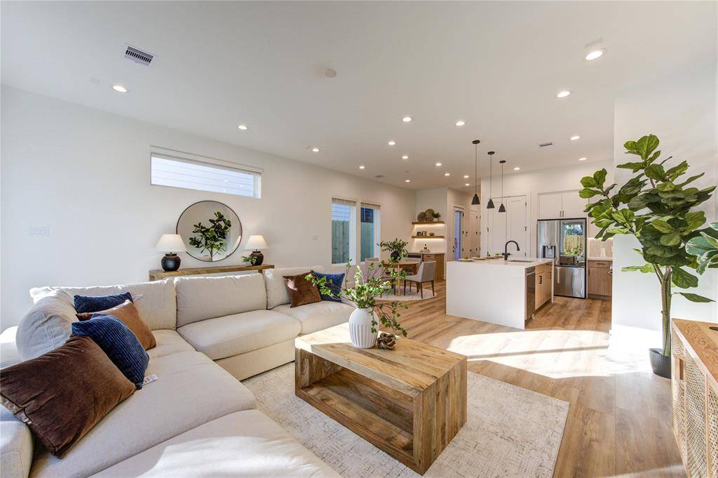 Large open living room with access to your private fenced in backyard.