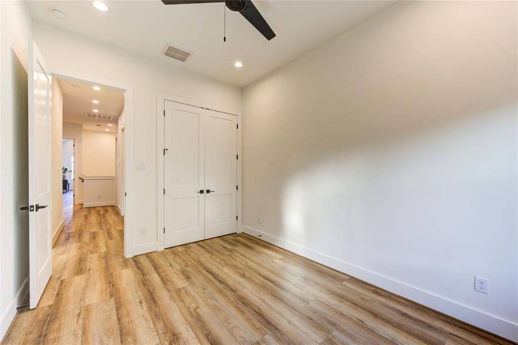 Bedroom 1. All bedroom feature ceiling fans pre-installed, LED recessed lighting, and large closets.