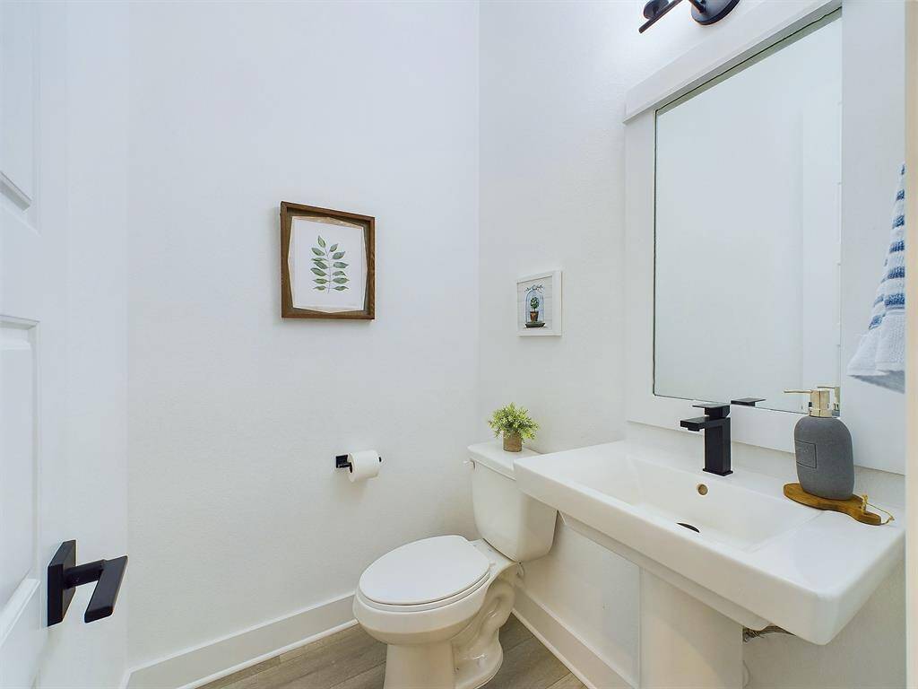 The powder room is conveniently located on the second floor. FINISHES & FLOOR PLANS WILL VARY!