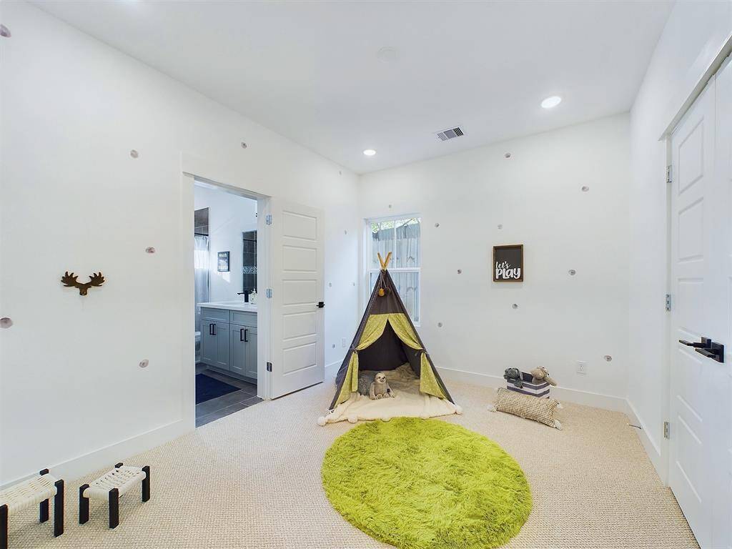 Spacious secondary bedroom on the first floor with lots of natural lighting. FINISHES & FLOOR PLANS WILL VARY! Ceiling fans are not included!