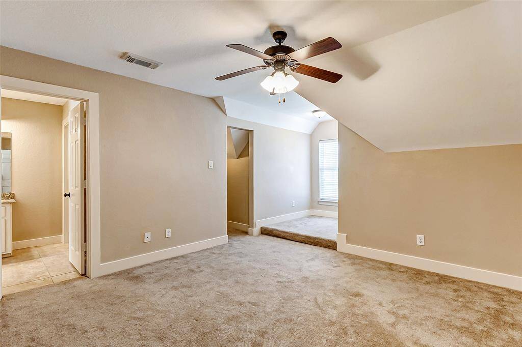 Like the other bedrooms, thisroom also offers a high ceiling, aceiling fan, plush carpet,decorator paint and a largewindow that floods the spacewith natural light.