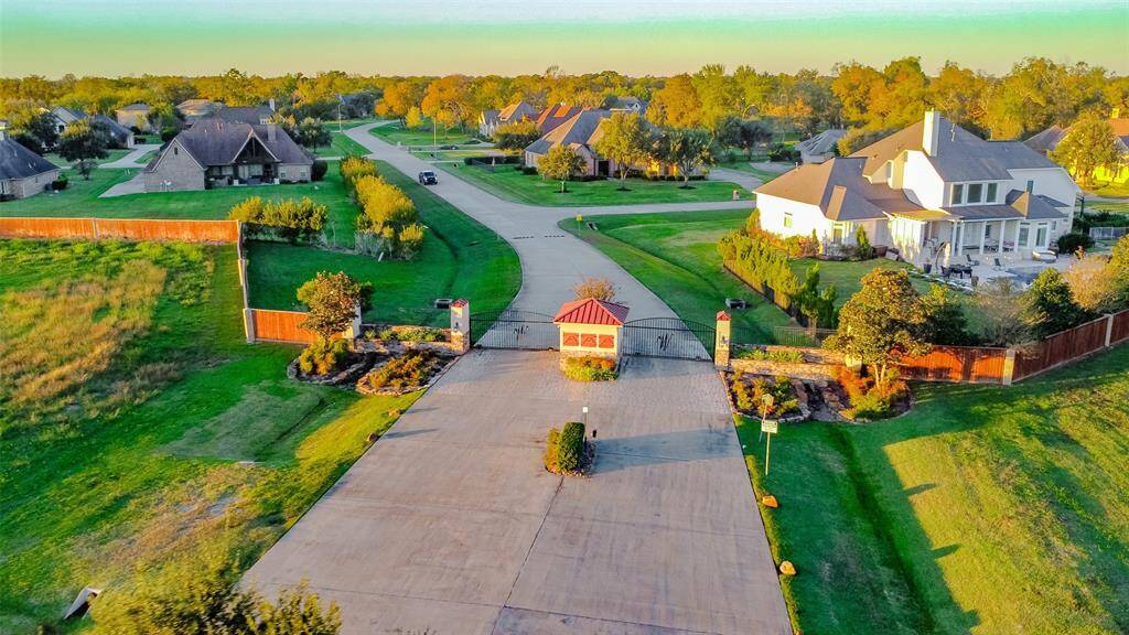 Experience the tranquility of this gated community, featuring a grand entrance, lush landscaping, and a serene atmosphere.
