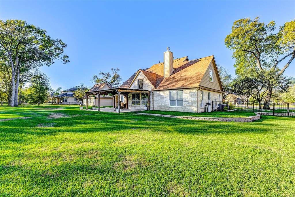 This pool-sized backyard also offers plenty of room for children to play or pets to roam.