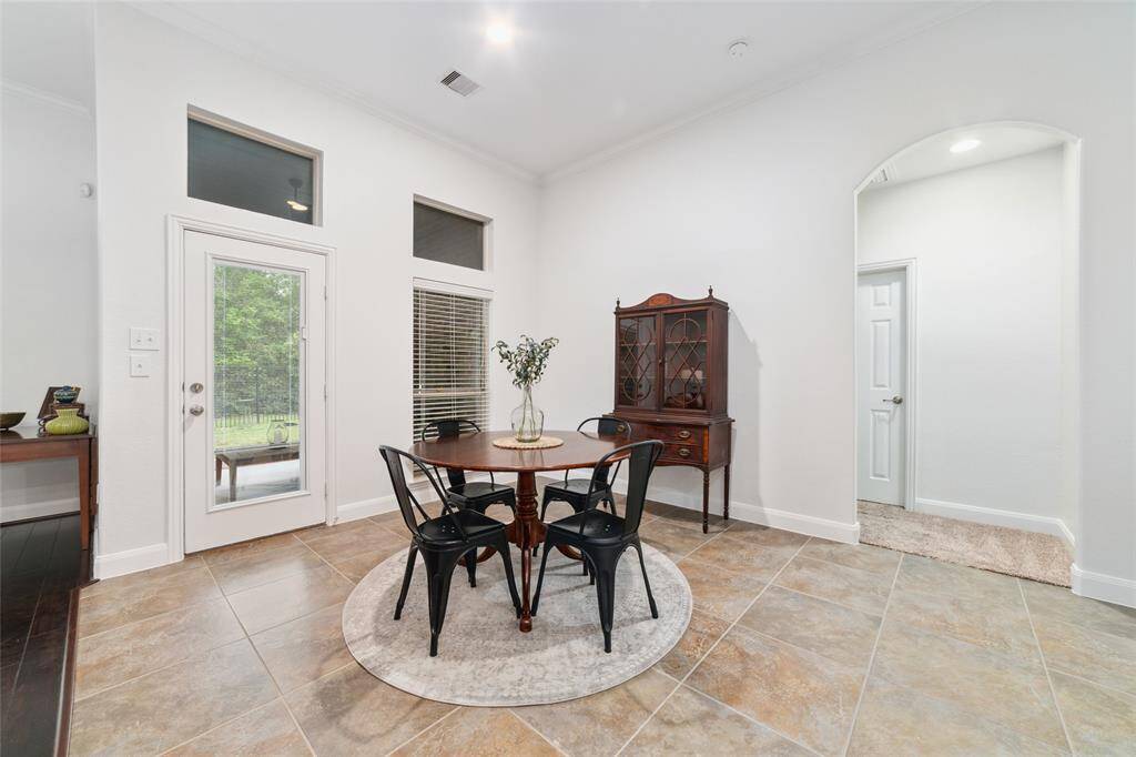 Great size breakfast room looking out to the covered patio.