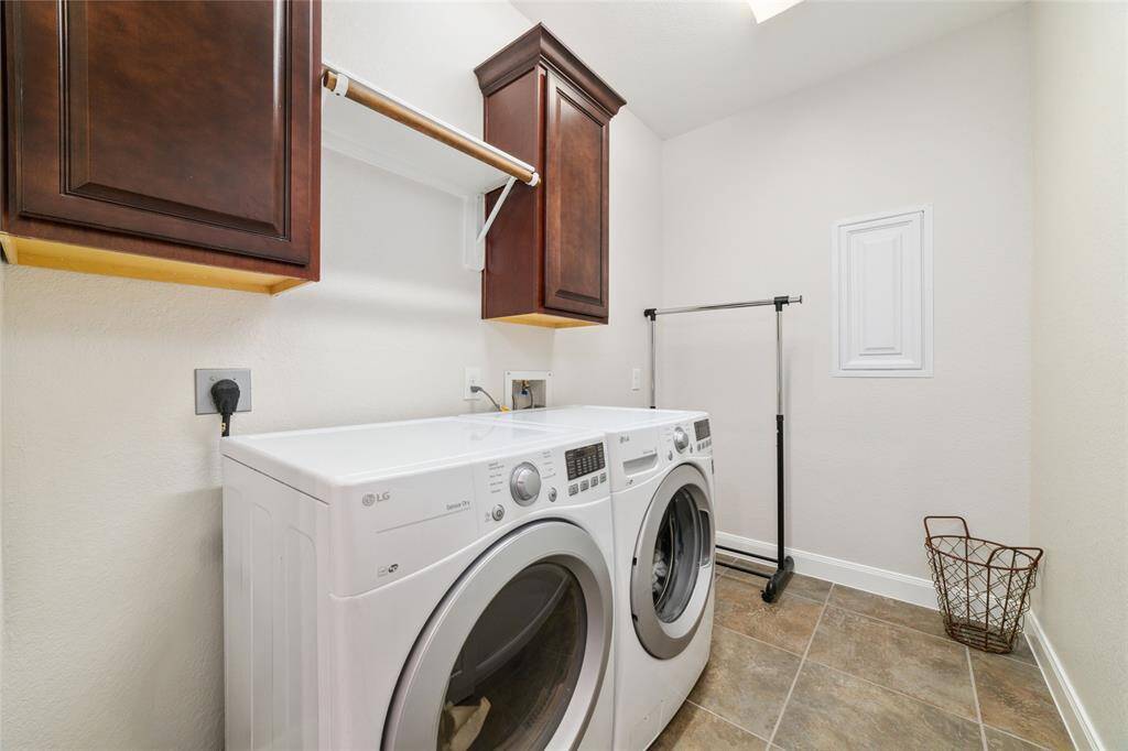 Laundry room is just across from the breakfast area.