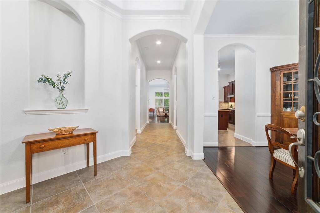 As you enter, you are greeted by tall ceilings, neutral paint and an updated look.