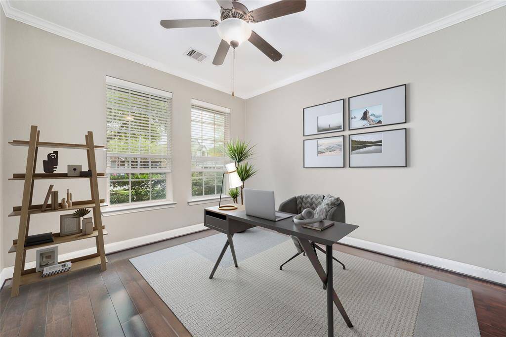 Office at front of home has been virtually staged.