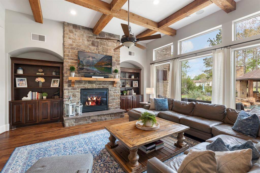 Gather around the fireplace and enjoy watching TV in this amazing space.